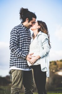 Pregnant Woman with her Housband Outside